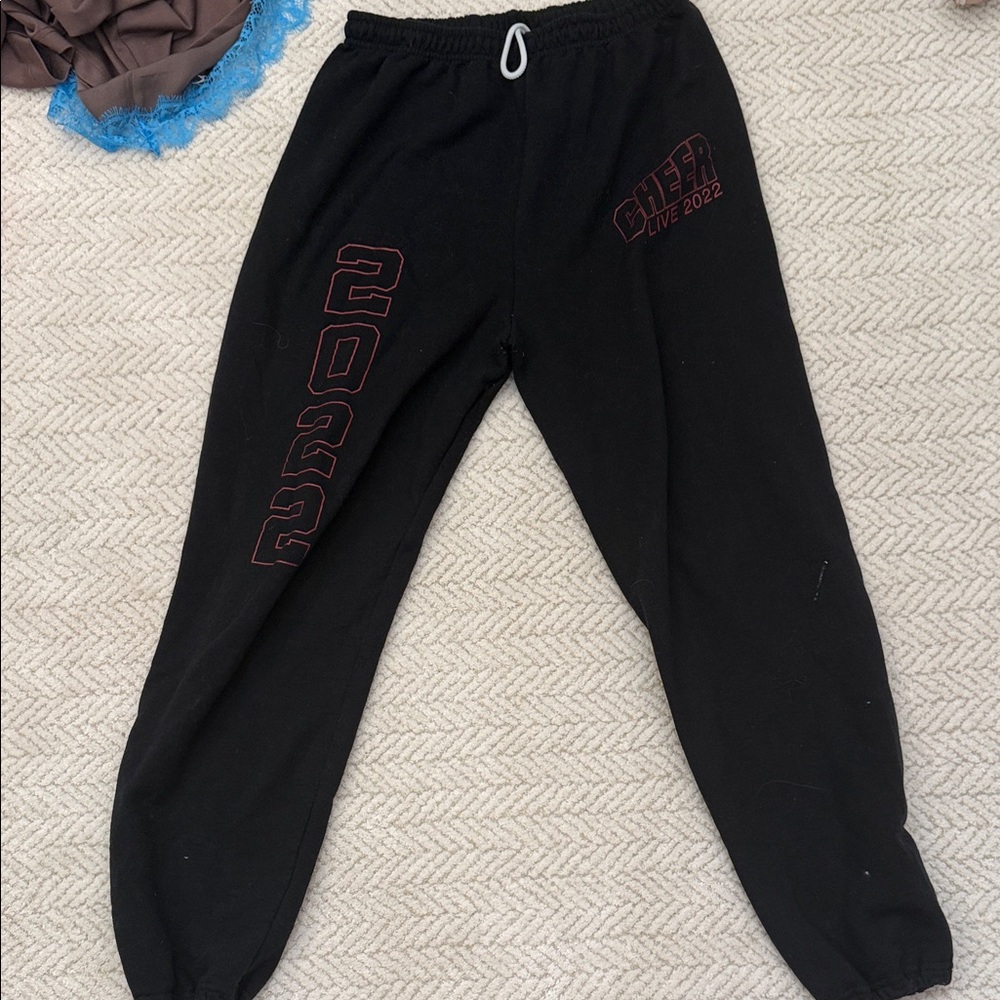 Black Graphic Sweatpants with Red Accent Cheer Netflix